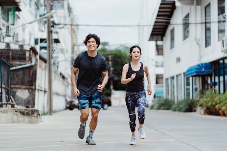 Two people running outdoors